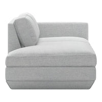 Light gray sectional sofa with subtle textured fabric and a modern, minimalist design. Ideal for contemporary interiors.