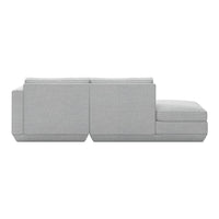 Light gray sectional sofa with a minimalist design and soft texture, perfect for modern living spaces.