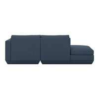 Modern navy blue sectional sofa with clean lines and a minimalistic design, perfect for contemporary living spaces.
