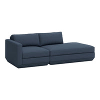 Dark blue sectional sofa with a modern design and clean lines. Soft fabric upholstery with a textured finish.