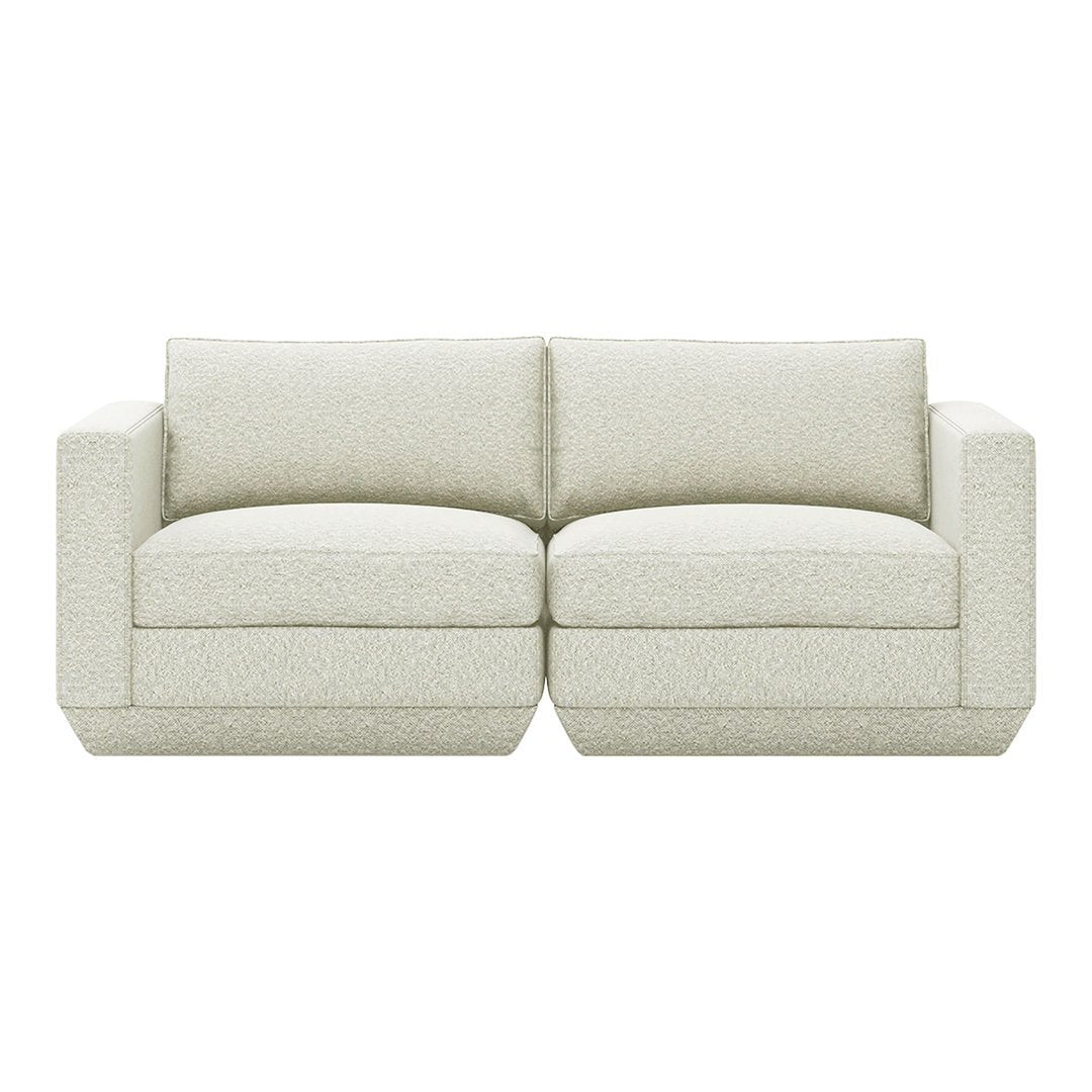 Light beige couch with subtle textured pattern, perfect for modern and minimalist interiors.