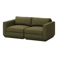 Green textured fabric loveseat with a modern, boxy design and plush cushions, perfect for contemporary interiors.