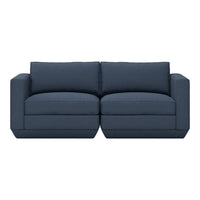 Navy blue fabric sofa with simple, modern design and plush cushions, perfect for contemporary living spaces.