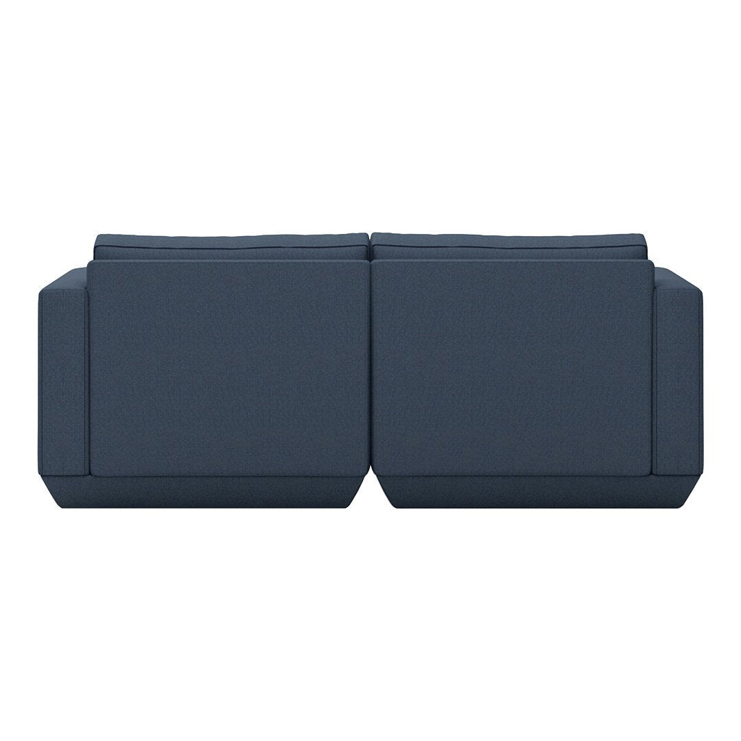 Navy blue modern couch with clean lines and a minimalist design, featuring a solid color and no visible patterns.
