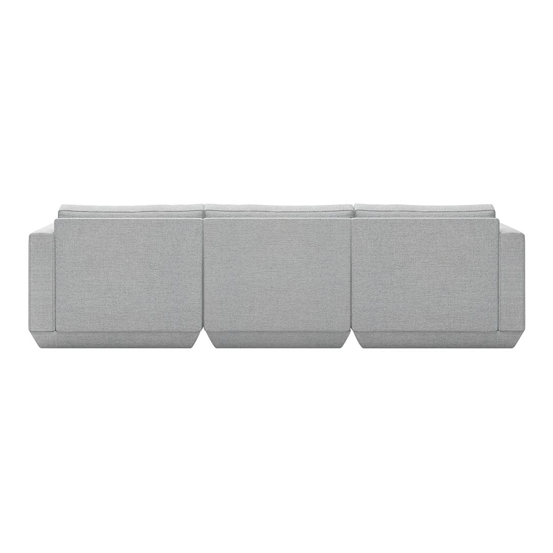 Gray upholstered sofa with a minimalist design, featuring a smooth texture and subtle tonal variations.