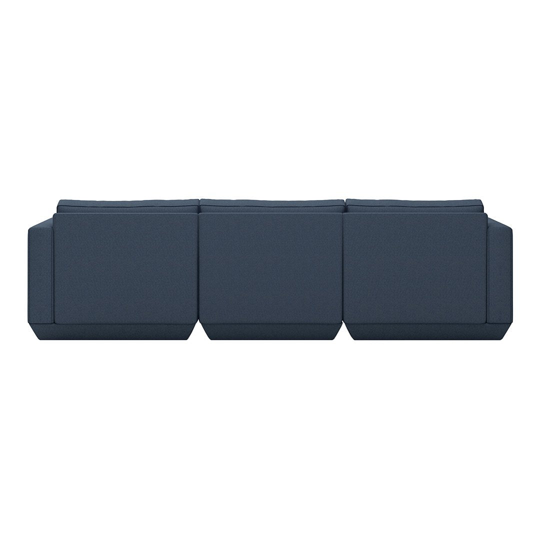 Navy blue modular sofa with a minimalist design and smooth, seamless upholstery. Perfect for modern living spaces.