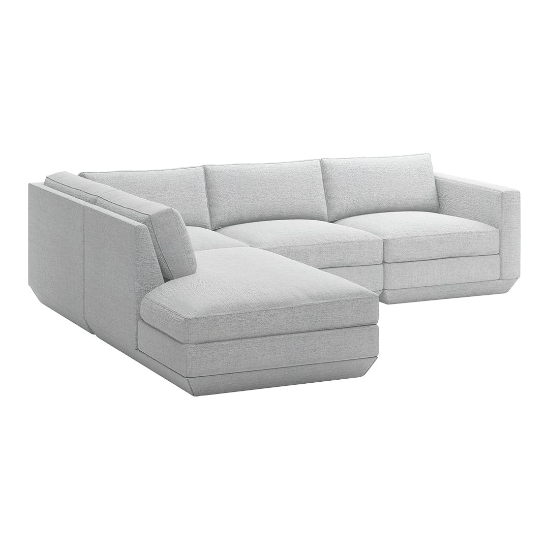 Light gray sectional sofa with smooth, modern upholstery and clean lines, perfect for contemporary living spaces.
