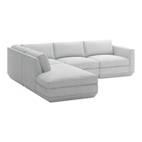 Light gray sectional sofa with smooth, modern upholstery and clean lines, perfect for contemporary living spaces.