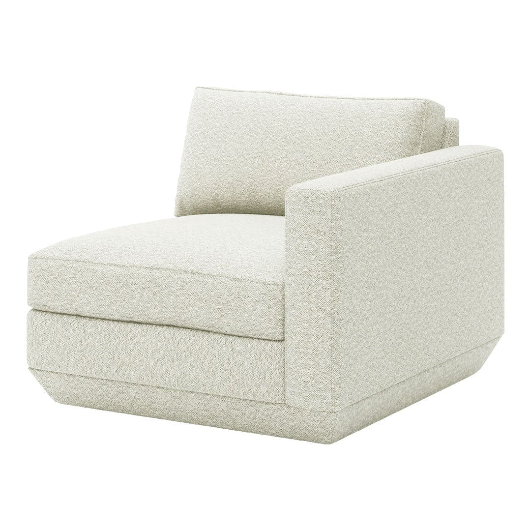 Cream-colored accent chair with a soft, textured fabric and minimalist design. Perfect for modern living spaces.
