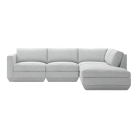 Light gray sectional sofa with soft fabric and minimalistic design, featuring subtle stitching details.