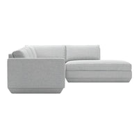Gray sectional sofa with smooth fabric and clean lines, featuring a minimalist design and modern aesthetic.