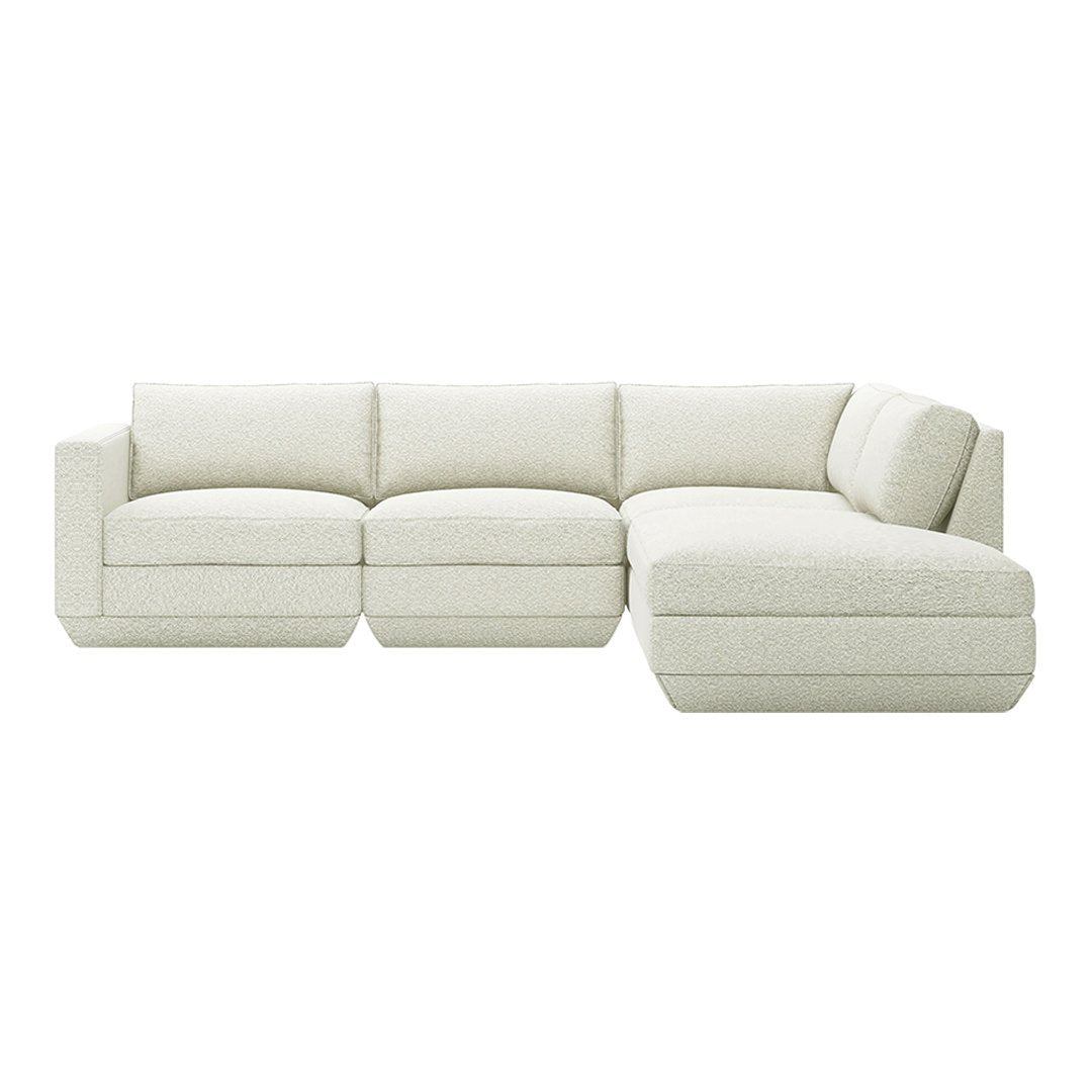 Neutral cream sectional sofa with a textured fabric, featuring clean lines and a contemporary design. Perfect for modern decor.