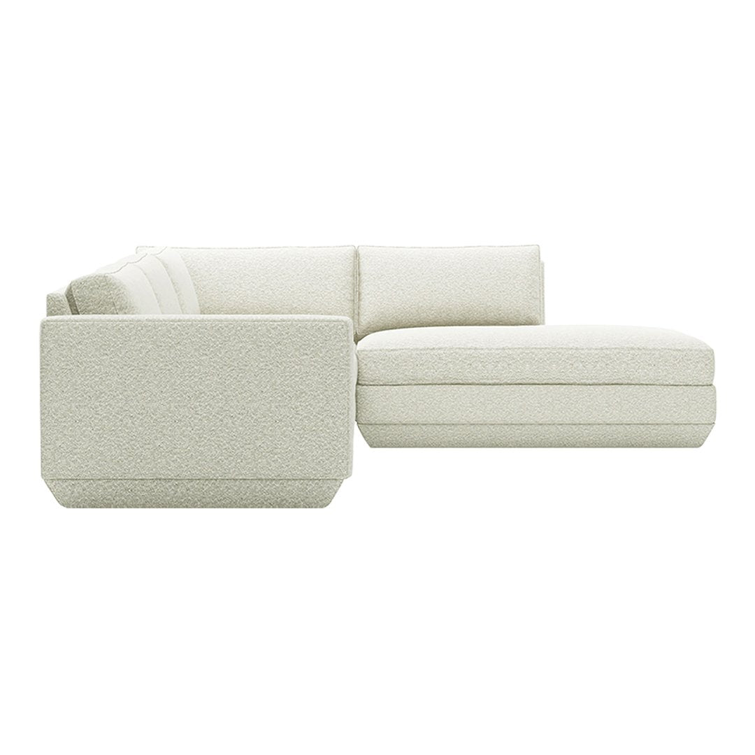 Light gray sectional sofa with a textured fabric and clean, modern lines. Perfect for minimalist decor.