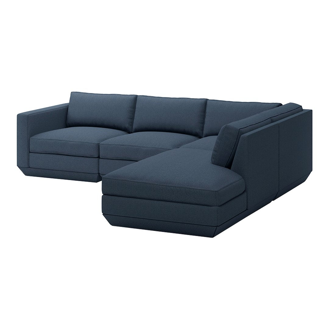 Dark navy blue sectional sofa with a minimalist design and solid fabric upholstery.
