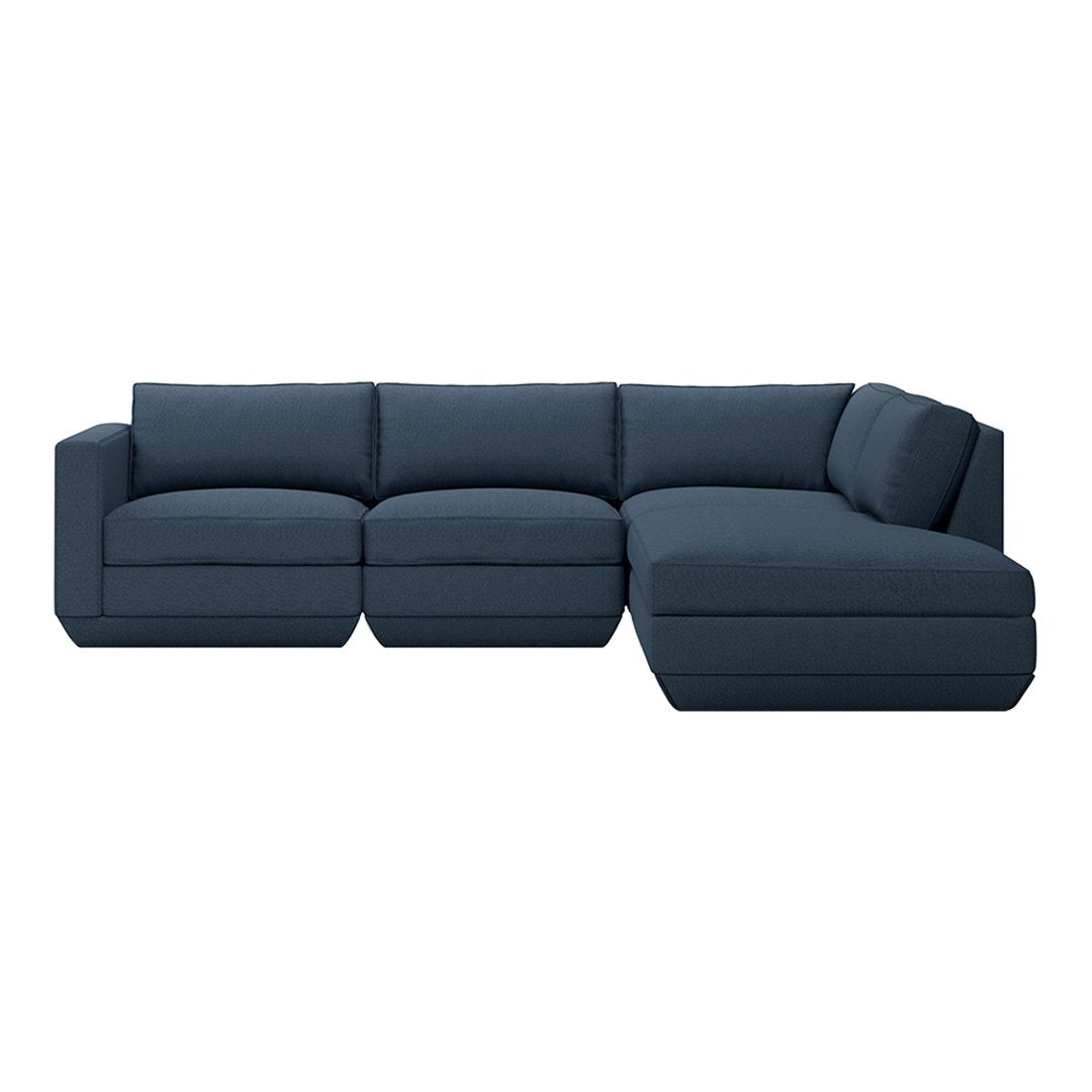 Dark navy blue sectional sofa with solid fabric and plush cushions for a modern, stylish look.