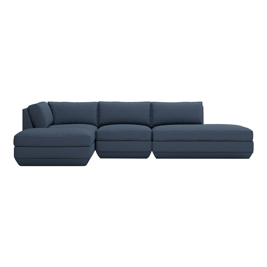 Navy blue sectional sofa with smooth upholstery and modern, minimalist design. Perfect for stylish living rooms.