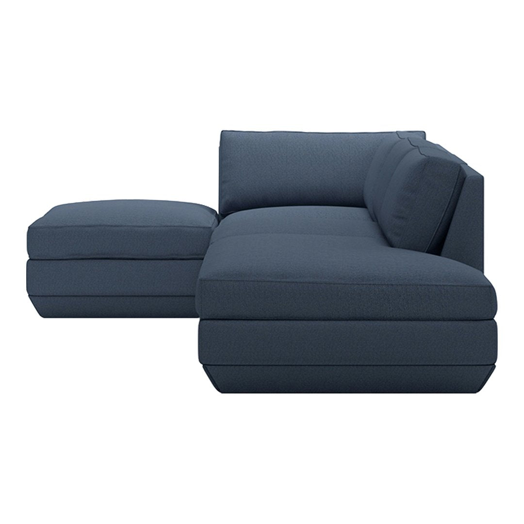 Navy blue modern sectional sofa with solid fabric and sleek lines, perfect for contemporary living spaces.