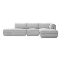 Light gray sectional sofa with a minimalist design and subtle texture for modern living spaces.