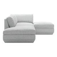Light gray sectional sofa with a modern, minimalist design and smooth fabric texture. Perfect for contemporary living spaces.