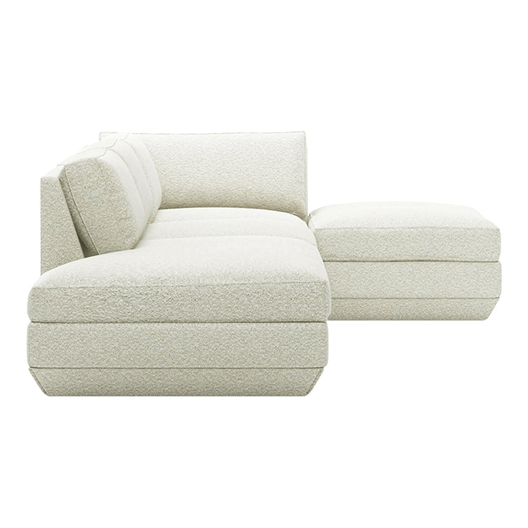 Textured off-white sectional sofa with plush cushions and a modern, minimalist design. Ideal for stylish living spaces.