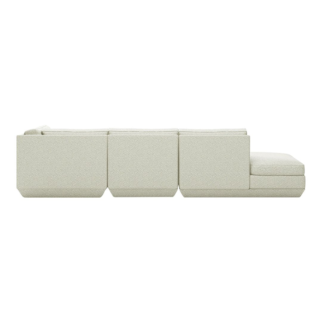 Light beige sectional sofa with a minimalist design and textured fabric, perfect for modern living spaces.