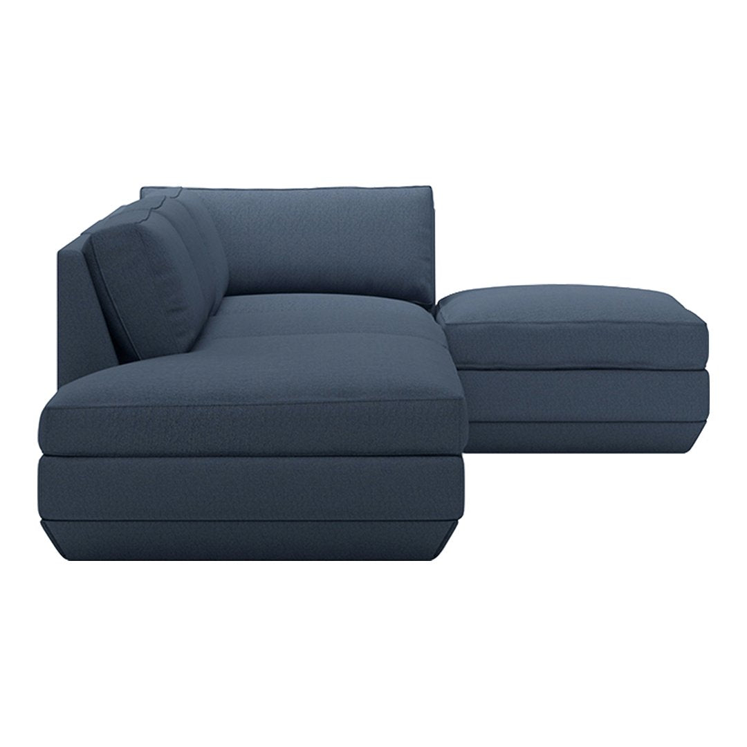 Modern navy blue sectional sofa with a sleek, minimalist design and subtle textured fabric. Perfect for contemporary decor.