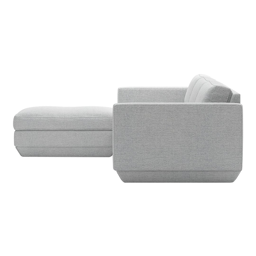 Light gray sectional sofa with a smooth textured fabric and minimalist design. Perfect for modern interiors.