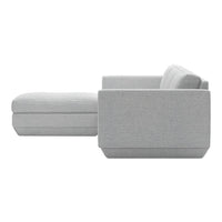 Light gray sectional sofa with a smooth textured fabric and minimalist design. Perfect for modern interiors.