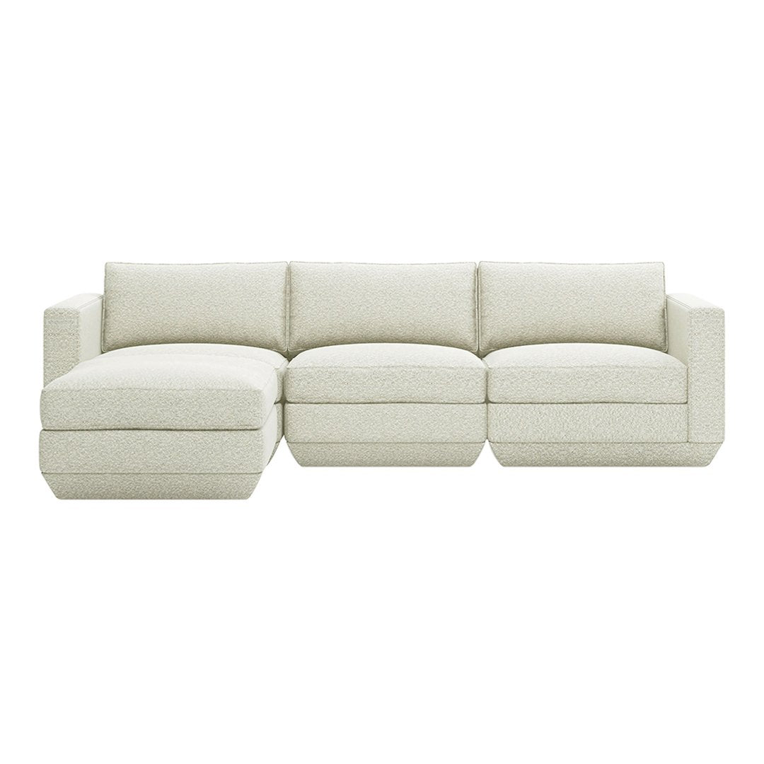 Light cream sectional sofa with textured fabric and clean, modern lines for versatile home decor.