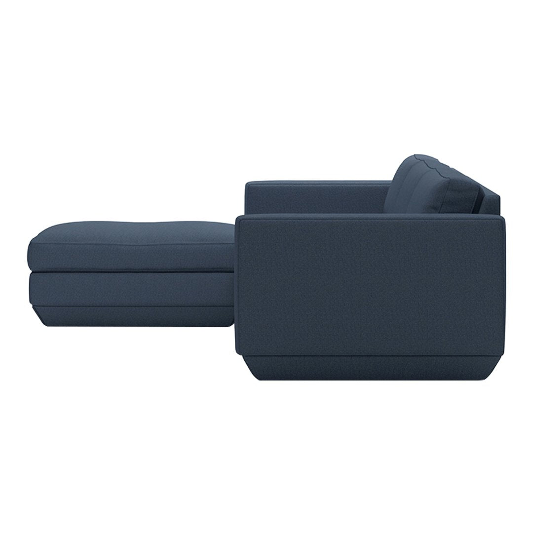 Navy blue sectional sofa with clean lines and a modern design, featuring a solid color and minimalist style.