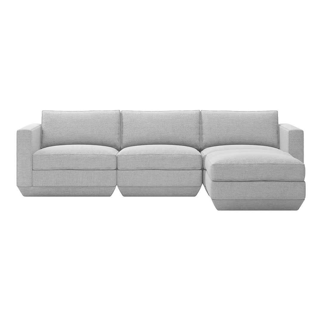 Light gray sectional sofa with a textured fabric and clean, modern lines, perfect for contemporary living spaces.