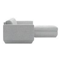 Light gray sectional sofa with a smooth, textured fabric and clean lines, perfect for modern living spaces.
