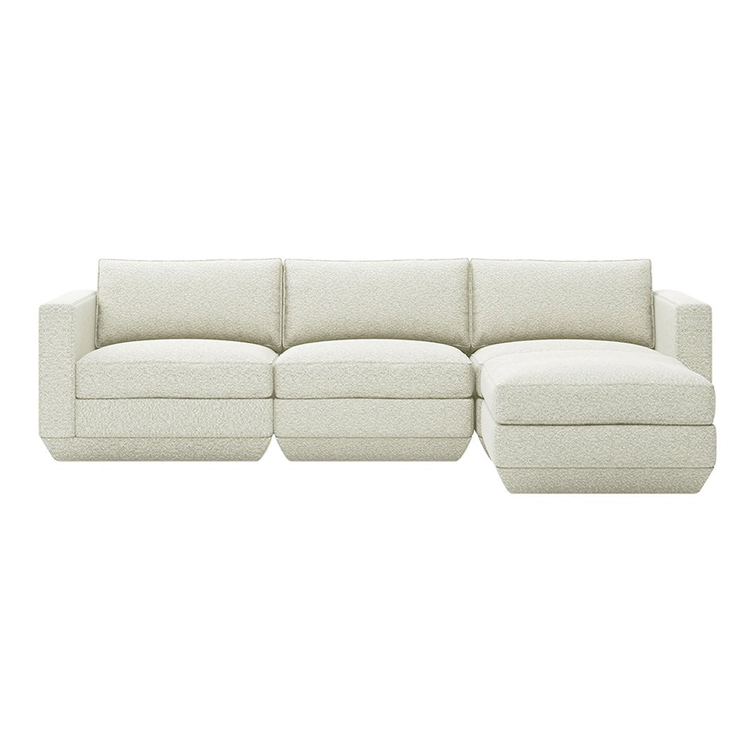 Light beige sectional sofa with a soft, textured fabric and clean, modern lines. Perfect for contemporary living spaces.