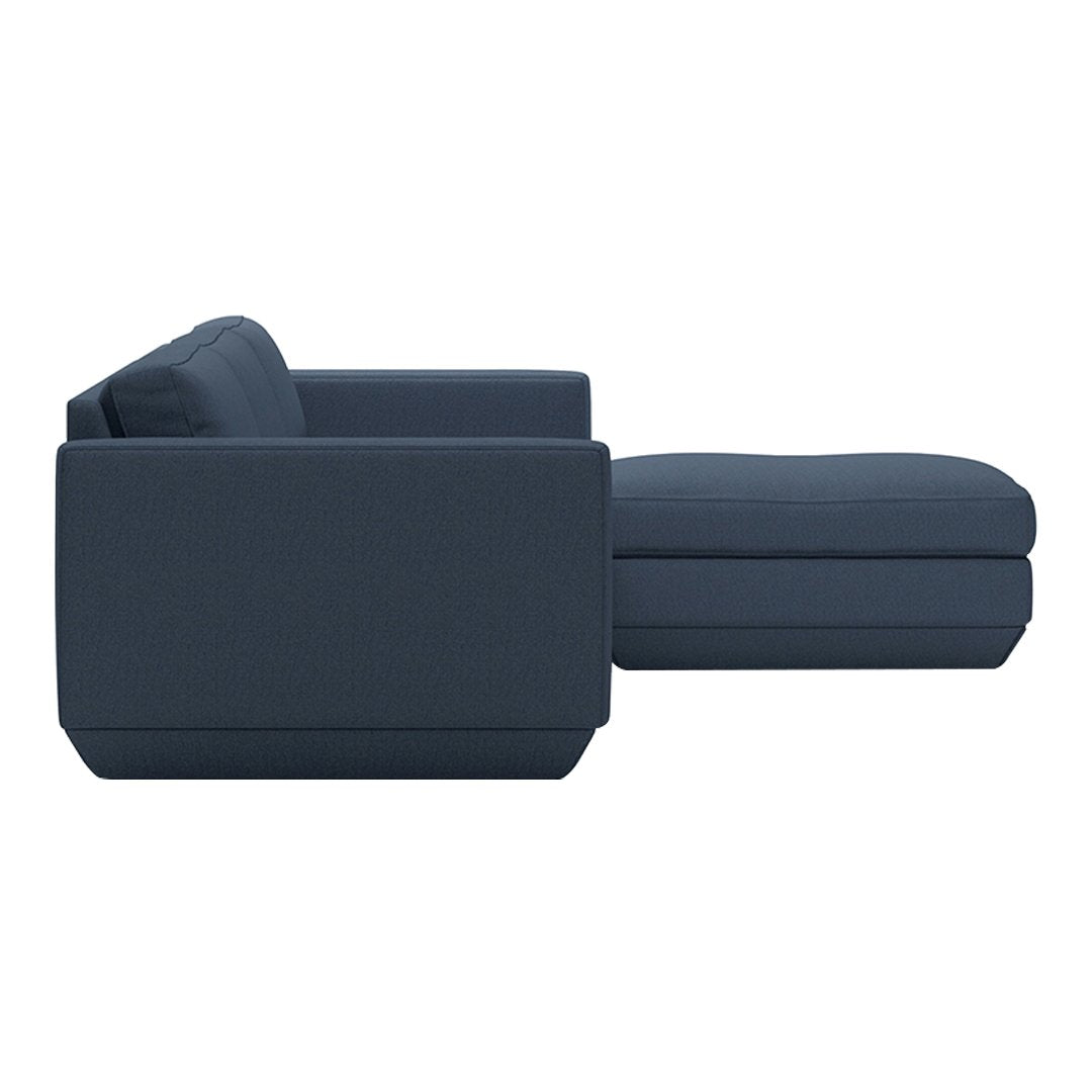 Modern navy blue sectional sofa with a sleek, minimalist design and soft, textured fabric. Perfect for contemporary decor.