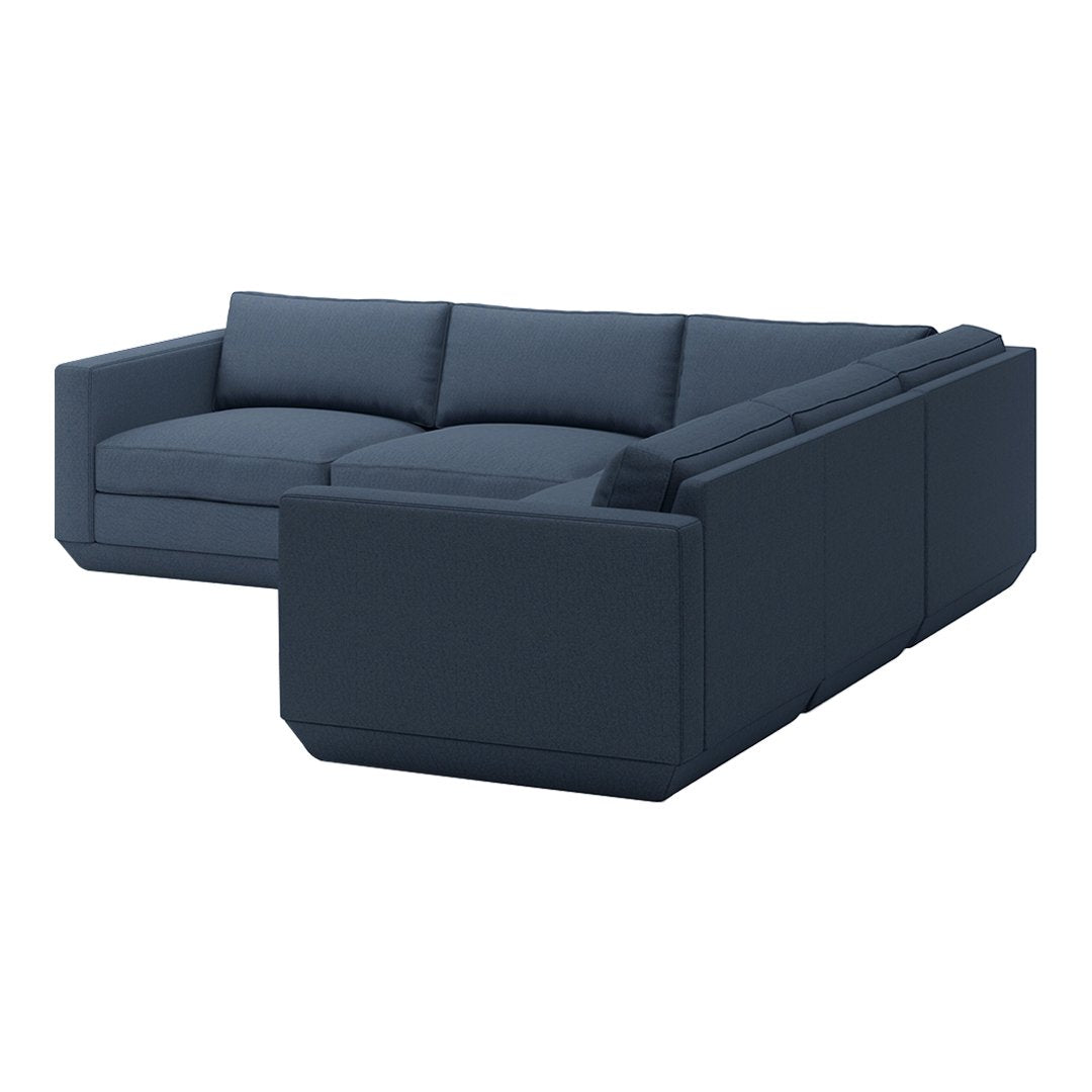 Navy blue sectional sofa with clean lines and subtle textured fabric for modern living spaces.