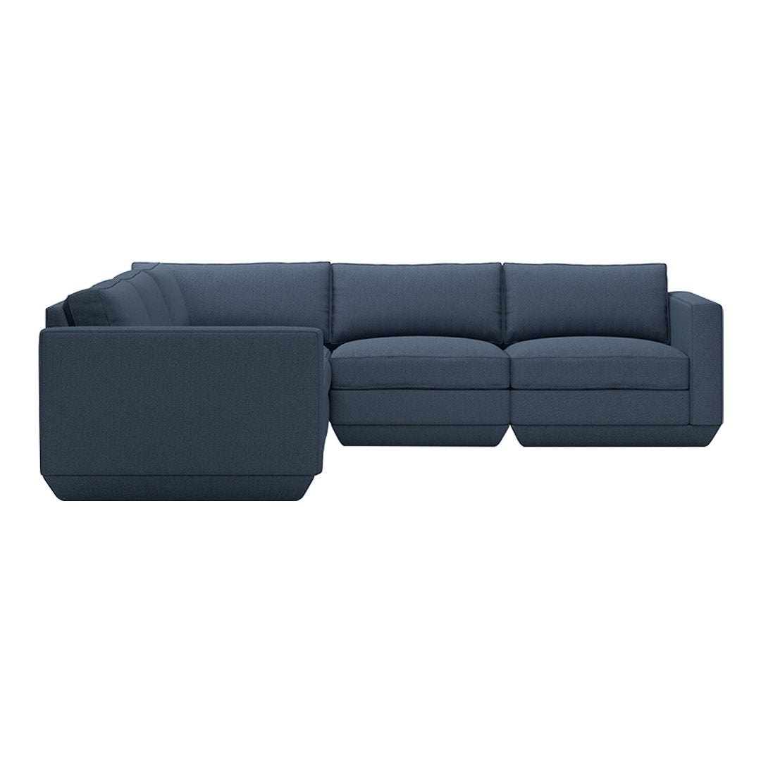 Dark navy blue sectional sofa with solid color upholstery and modern, minimalist design. Perfect for contemporary interiors.