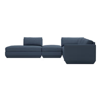 Navy blue sectional sofa with plush cushions and a sleek, modern design. Ideal for contemporary living spaces.