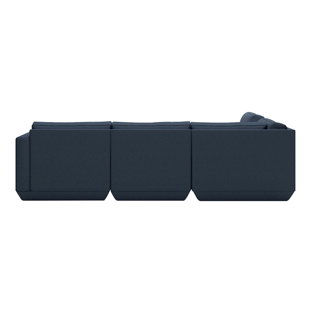 Dark blue modular couch with a sleek, modern design and clean lines, perfect for contemporary living spaces.