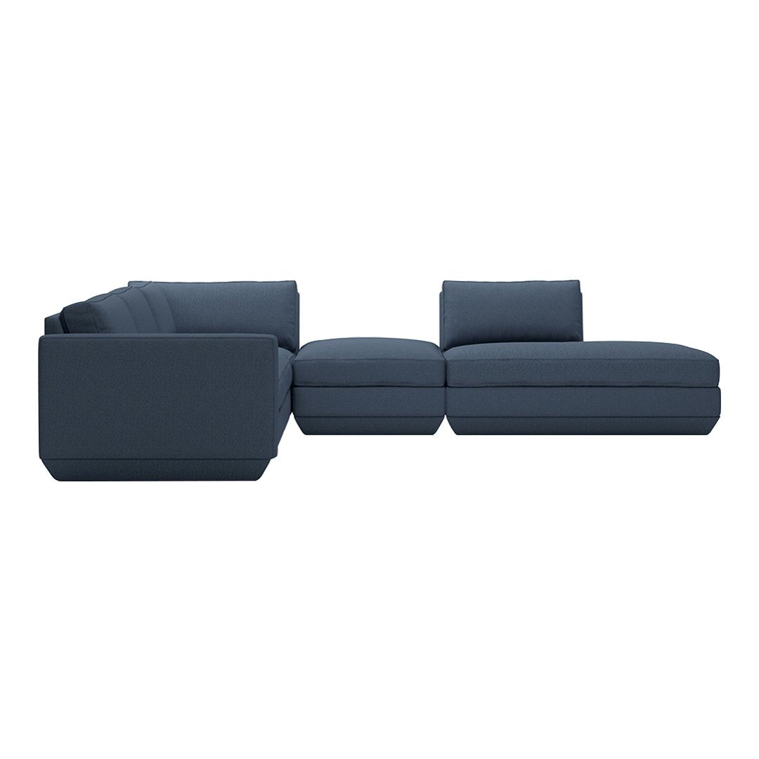 Navy blue sectional sofa with a modern design and subtle texture. Perfect for contemporary living spaces.