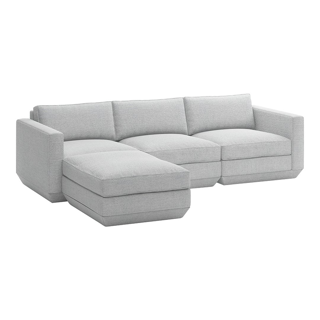 Light gray sectional sofa with a sleek fabric finish, featuring clean lines and a modern minimalist design.