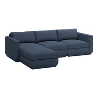 Deep navy blue sectional sofa with modern, clean lines and plush cushions. Perfect for contemporary living spaces.