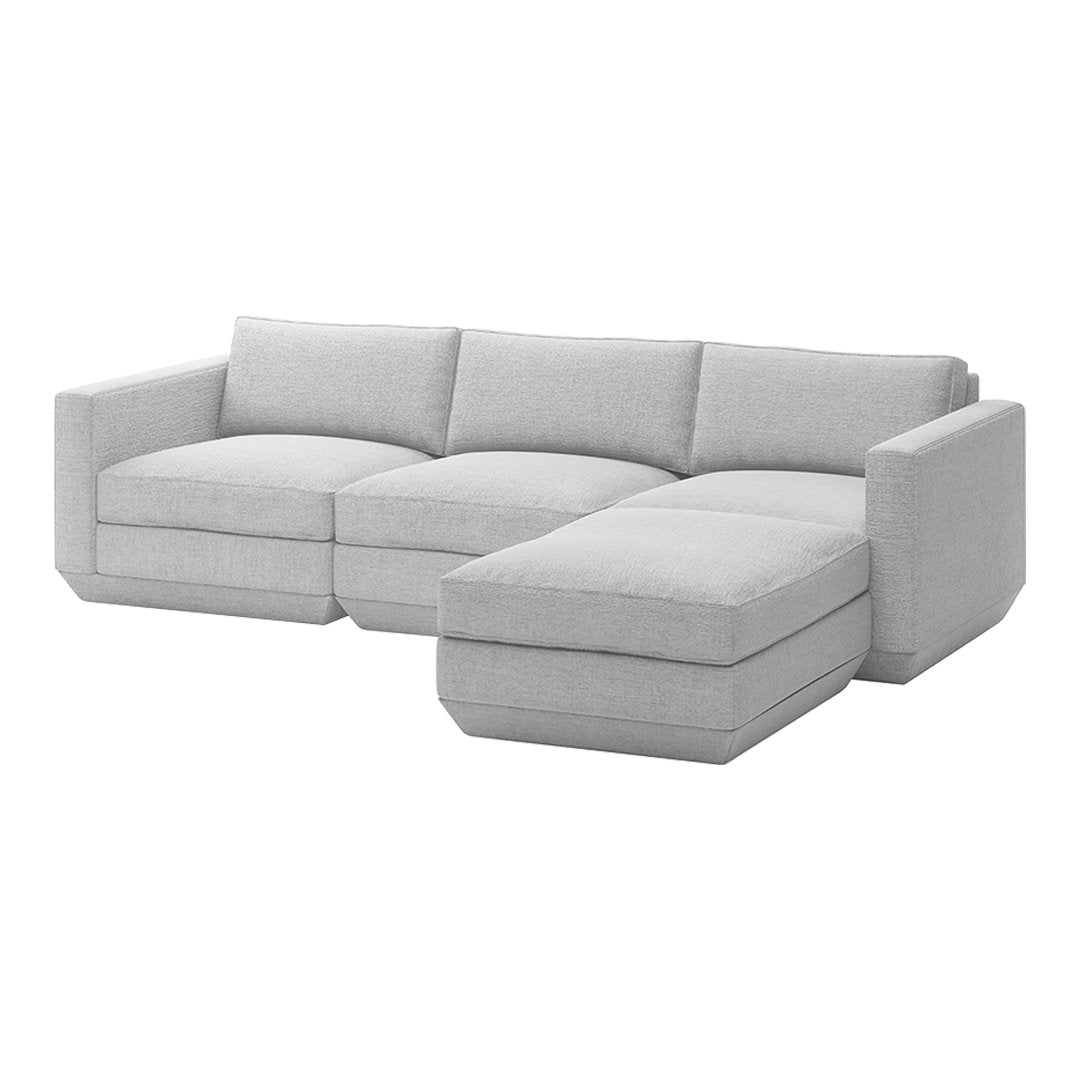 Light gray sectional sofa with a clean, modern design and soft fabric upholstery, featuring minimalistic lines and no patterns.