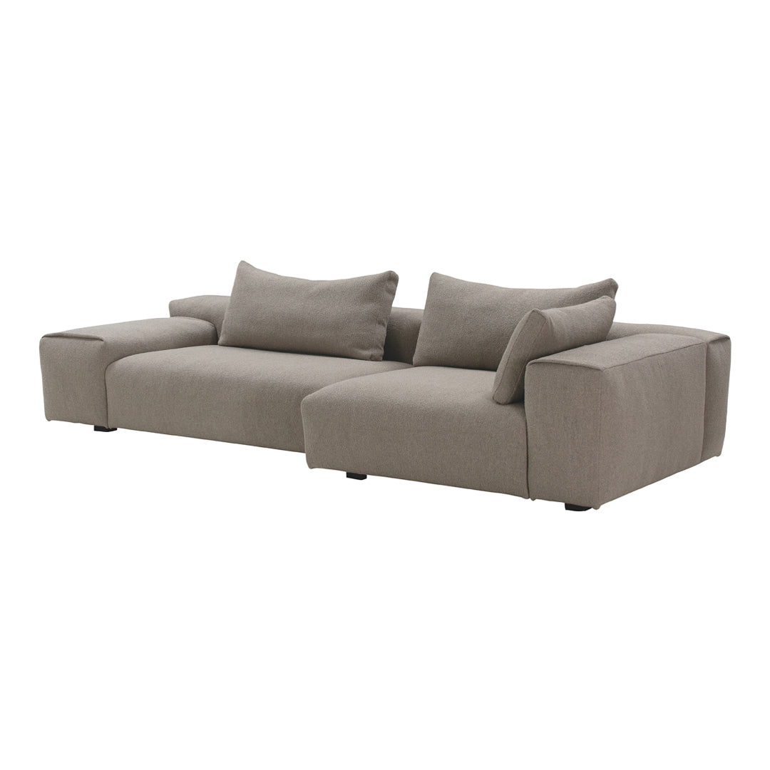 Light gray sectional sofa with a minimalist design and soft, textured fabric. Ideal for modern living spaces.