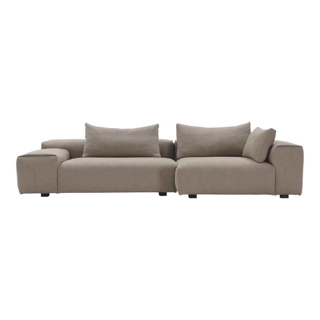 Modern beige sectional sofa with clean lines and plush cushions, perfect for contemporary living spaces.