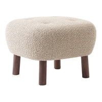Beige plush stool with fluffy texture and wooden legs, featuring a rounded, tufted design. Perfect for cozy spaces.