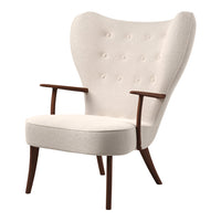 Cream upholstered chair with tufted buttons and wooden arms, featuring a sleek, mid-century modern design.