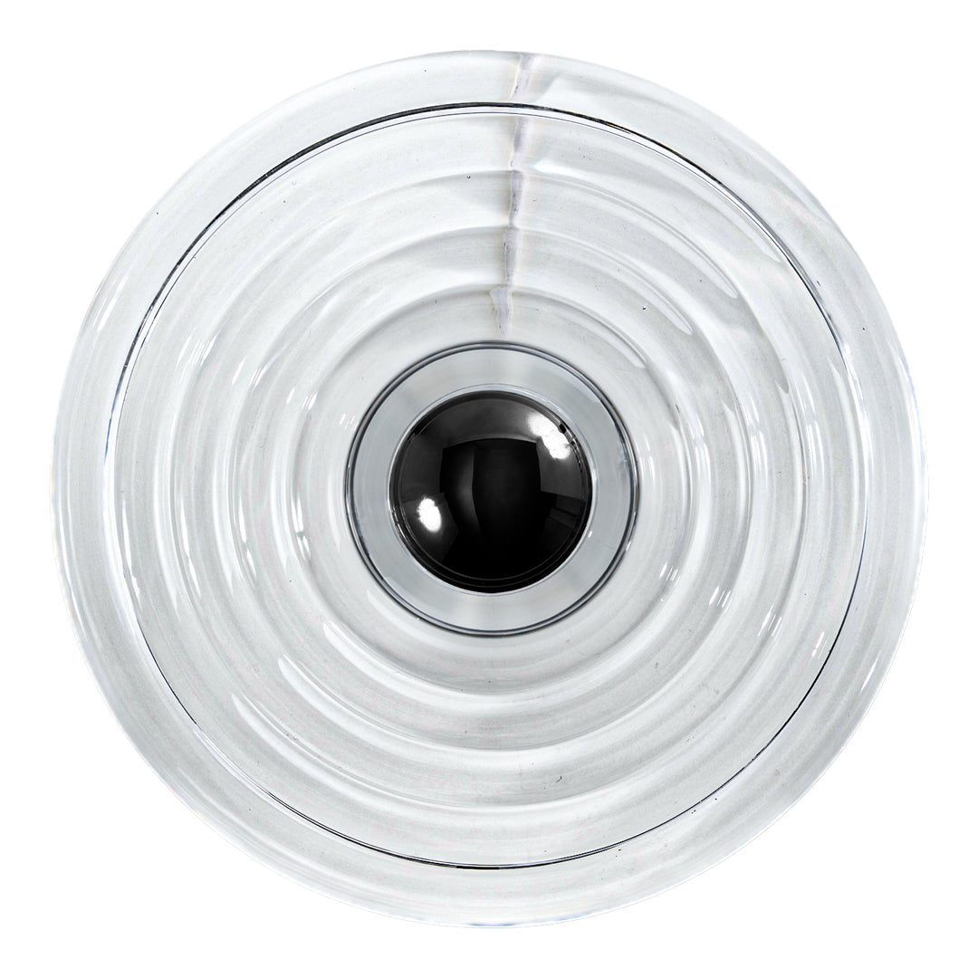 Clear glass bowl with concentric ripple patterns and a sleek black center, adding modern elegance to any decor.