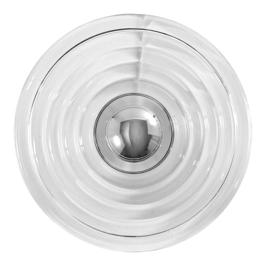 Clear glass bowl with concentric circular patterns and a shiny metallic center. Elegant and modern design.