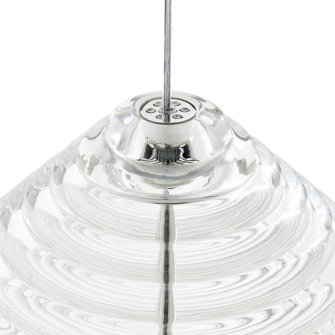 Clear glass pendant light with a wavy, ridged design, featuring a circular metallic mount. Ideal for modern decor.