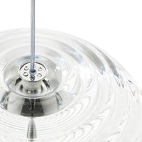 Clear glass pendant light with a rippled surface and chrome details, creating a sleek, modern look.
